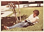 Student Reading under the Sun